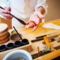 a chef itamae or master chef making sushi pasting 2023 11 27 05 27 17 utc